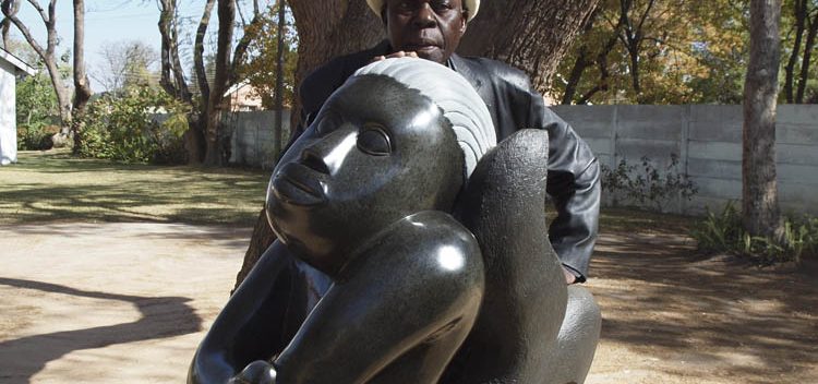 Sylvester Mubayi with one of his sculptures