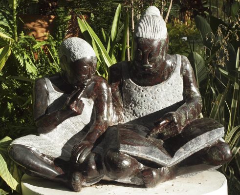 Shona sculpture Teach Me To Read by Jonathan Mhondorohuma