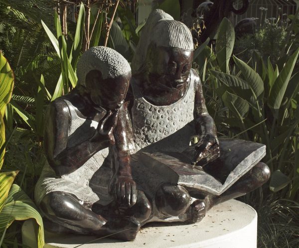 Shona sculpture Teach Me To Read by Jonathan Mhondorohuma