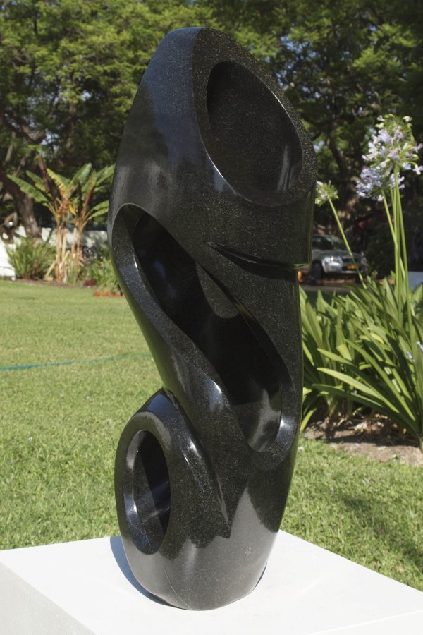 Shona sculpture The Energy Of Life by Munyaradzi Jeche - front right