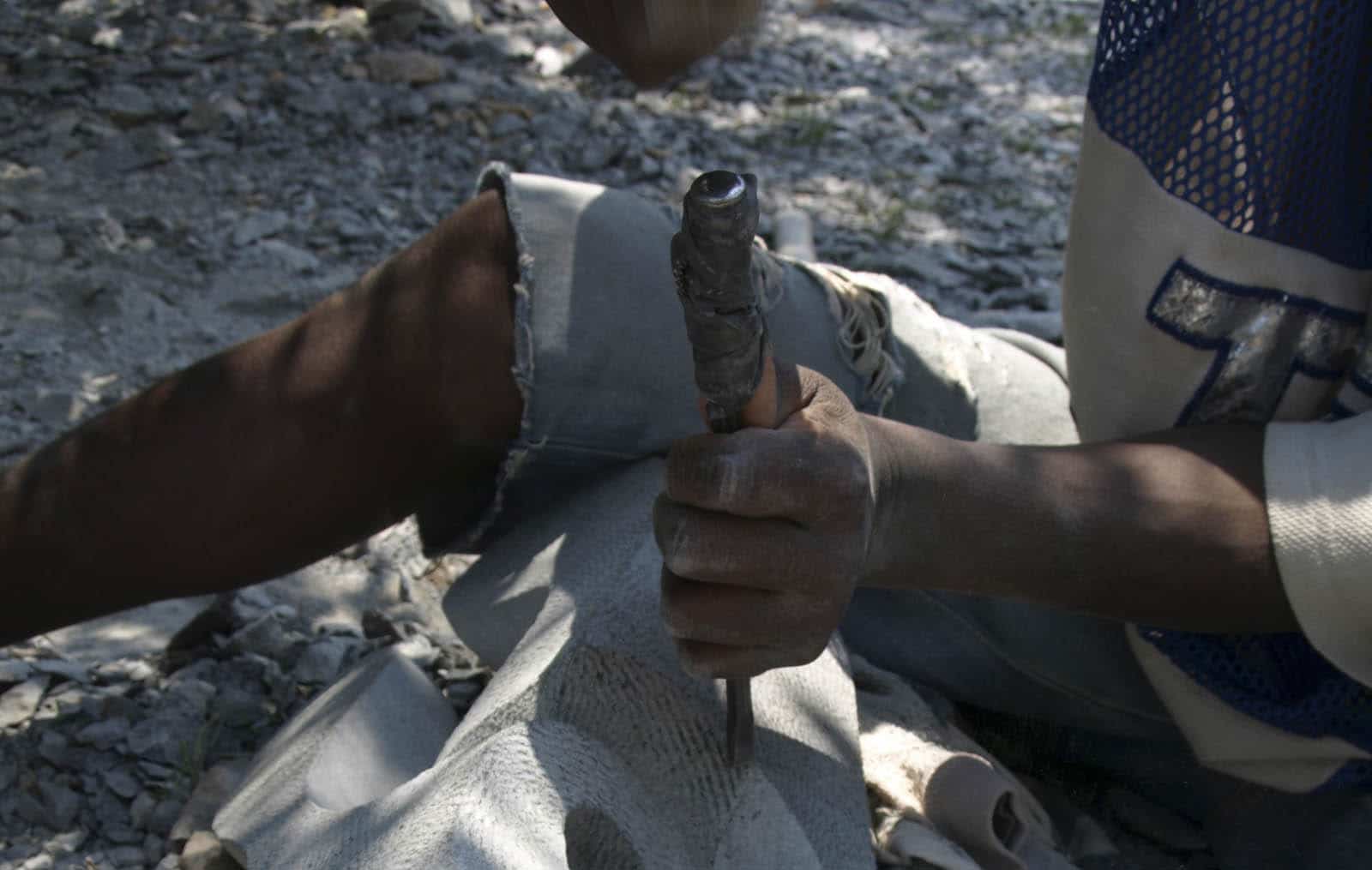 chiselling the sculpture smooth