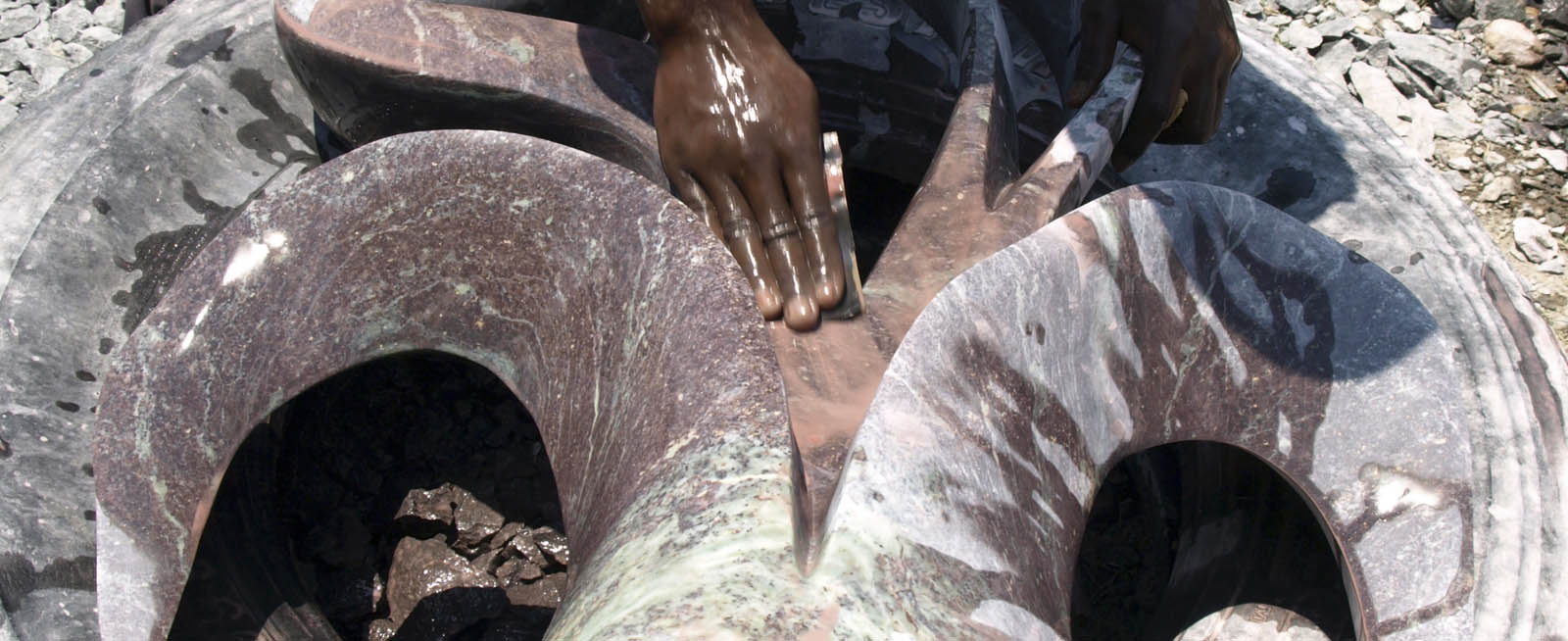 washing the sculpture with sandpaper