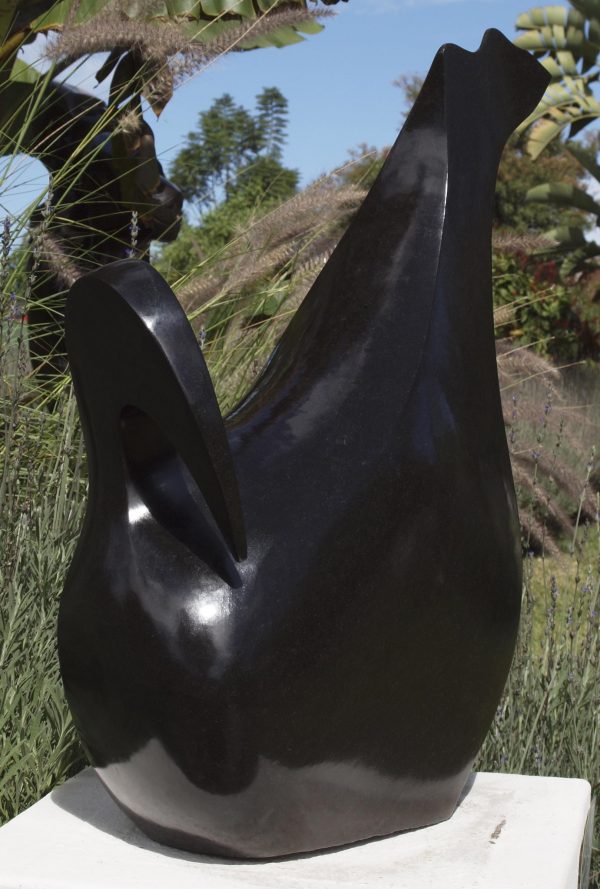 Abstract bird sculpture Relaxing Bird by Nesbert Mukomberanwa front left