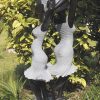 Garden sculpture two girls Party Day by Rufaro Murenza back left