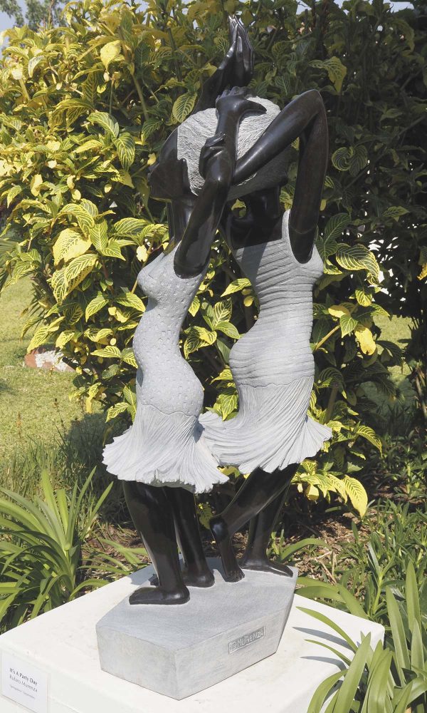 Garden sculpture two girls Party Day by Rufaro Murenza back left