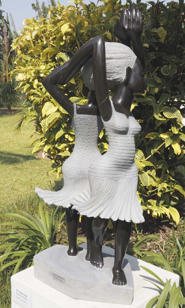 Garden sculpture two girls Party Day by Rufaro Murenza back right
