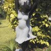 Garden sculpture two girls Party Day by Rufaro Murenza left side