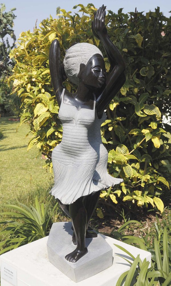 Garden sculpture two girls Party Day by Rufaro Murenza left side