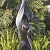 Lady woman stone sculpture - After Bathing by Lovemore Bonjisi front left