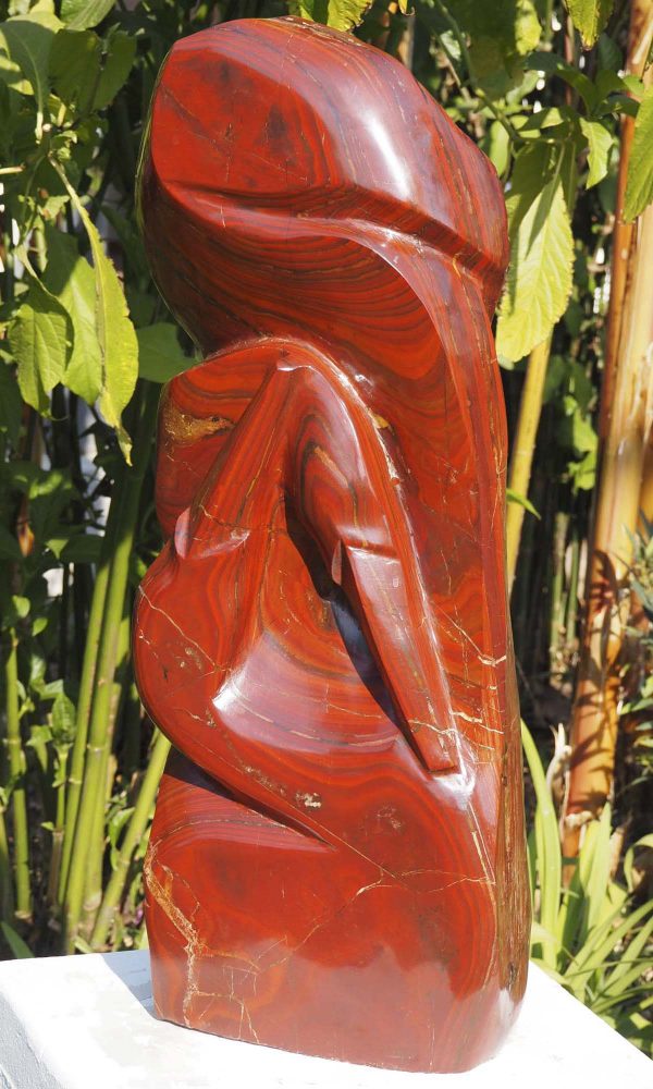 Birds sculpture red stone Tickling by Tago Tazvitya front right