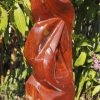 Birds sculpture red stone Tickling by Tago Tazvitya left side