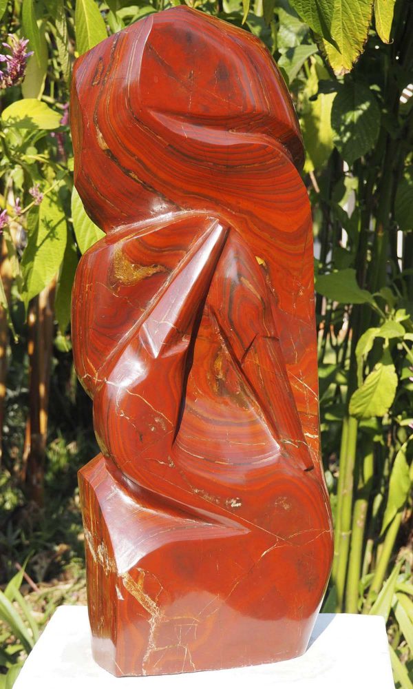 Birds sculpture red stone Tickling by Tago Tazvitya front left