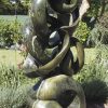 Abstract stone garden sculpture Achievements by Willard Bopoto back left