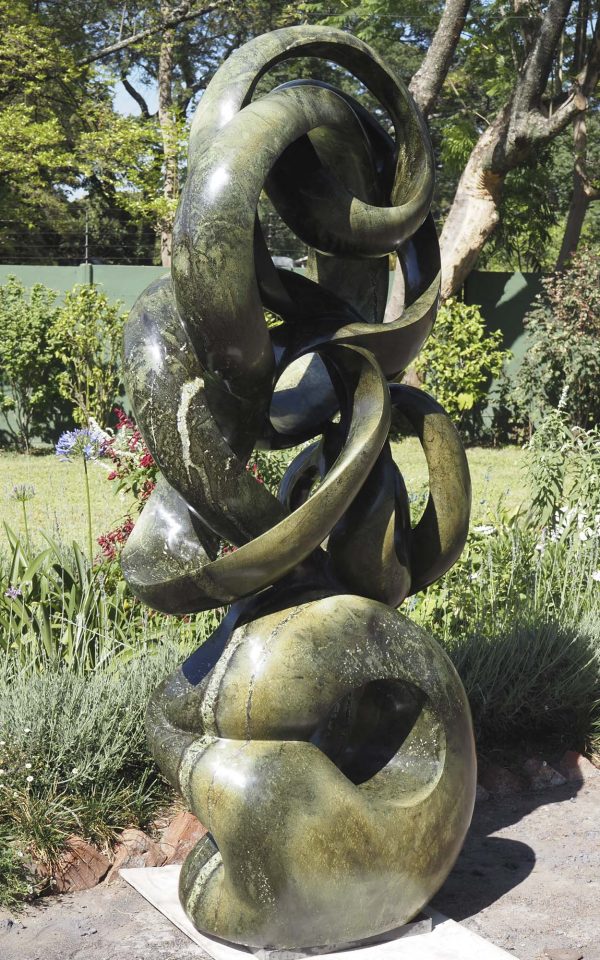 Abstract stone garden sculpture Achievements by Willard Bopoto back left