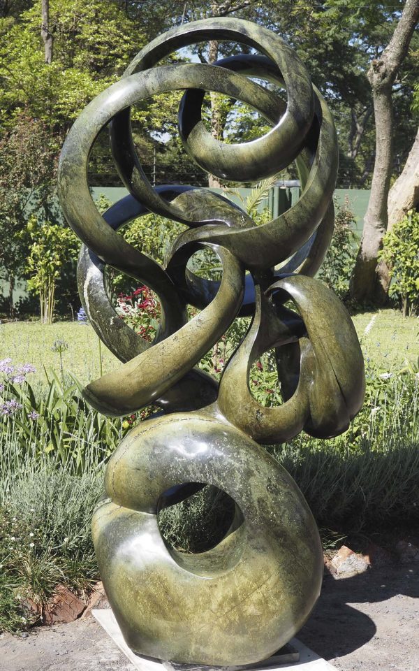 Abstract stone garden sculpture Achievements by Willard Bopoto back