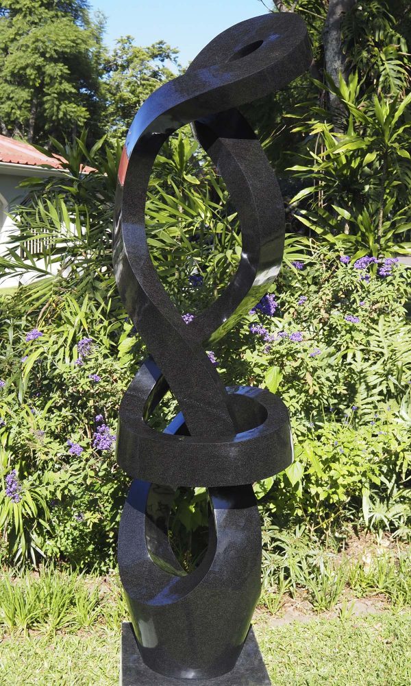 Large abstract Shona stone sculpture - Protecting Bride by Charles Kowo front right