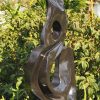 Garden stone bird sculpture - Joy Of Togetherness by Tago Tazvitya back left