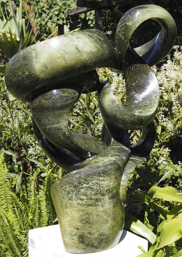 Abstract garden stone sculpture - Growing Force by Willard Bopoto back left