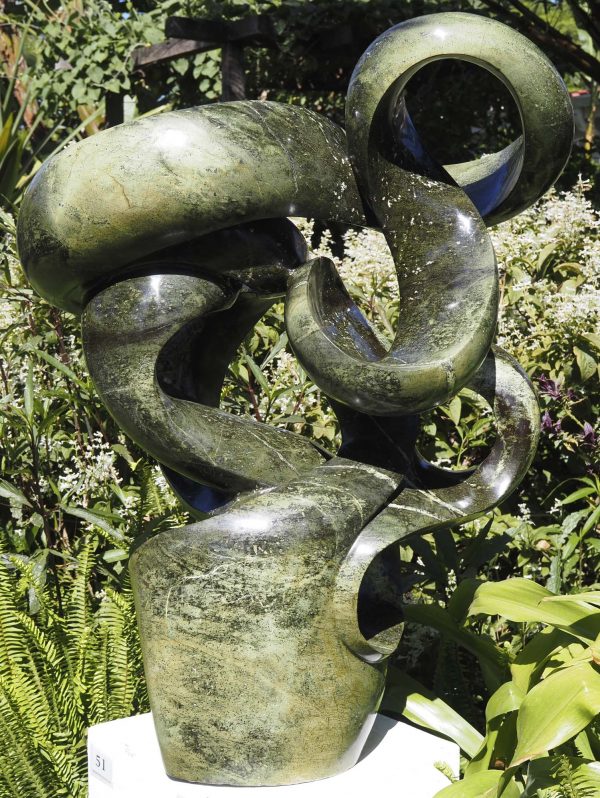 Abstract garden stone sculpture - Growing Force by Willard Bopoto back