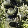 Abstract garden stone sculpture - Growing Force by Willard Bopoto back right