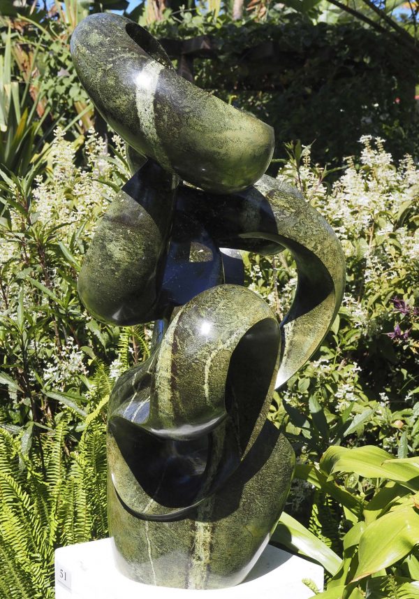 Abstract garden stone sculpture - Growing Force by Willard Bopoto left side
