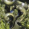 Abstract garden stone sculpture - Growing Force by Willard Bopoto front left
