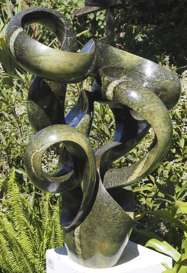 Abstract garden stone sculpture - Growing Force by Willard Bopoto front left
