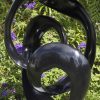 Abstract black stone sculpture - Opportunity by Tonderai Sowa front right