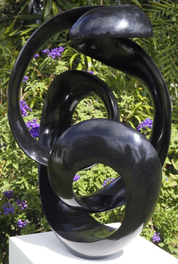 Abstract black stone sculpture - Opportunity by Tonderai Sowa front right