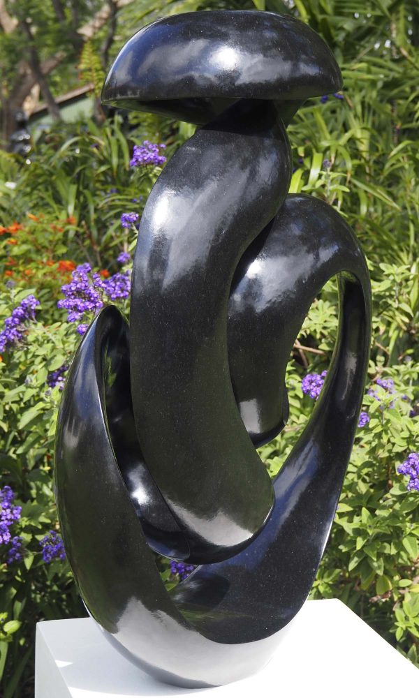 Abstract black stone sculpture - Opportunity by Tonderai Sowa back left