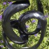 Abstract black stone sculpture - Opportunity by Tonderai Sowa back