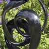 Abstract black stone sculpture - Opportunity by Tonderai Sowa back right