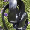 Abstract black stone sculpture - Opportunity by Tonderai Sowa front left